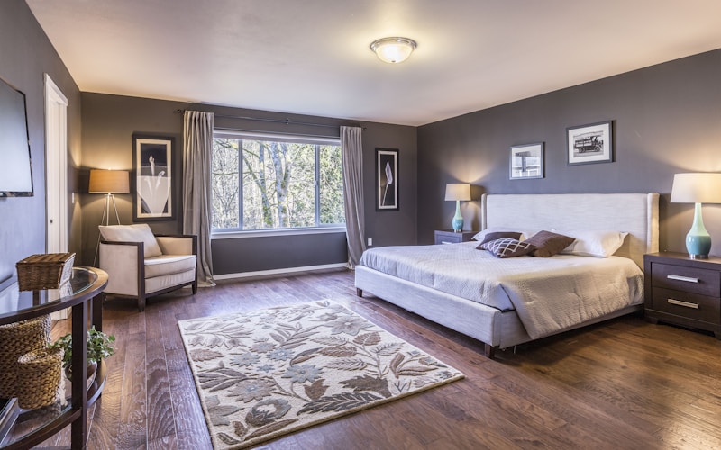 Bright teal colored front door with spring wreath